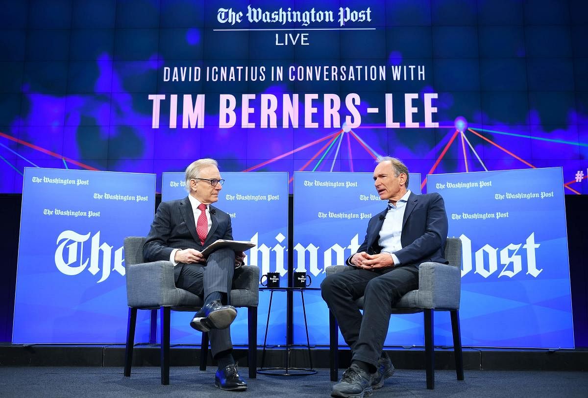 Washington Post columnist David Ignatius (L) listens during an interview with Tim Berners-Lee, the inventor of the World Wide Web, at the Washington Post in Washington, DC on March 5, 2019. (Photo by MANDEL NGAN / AFP)