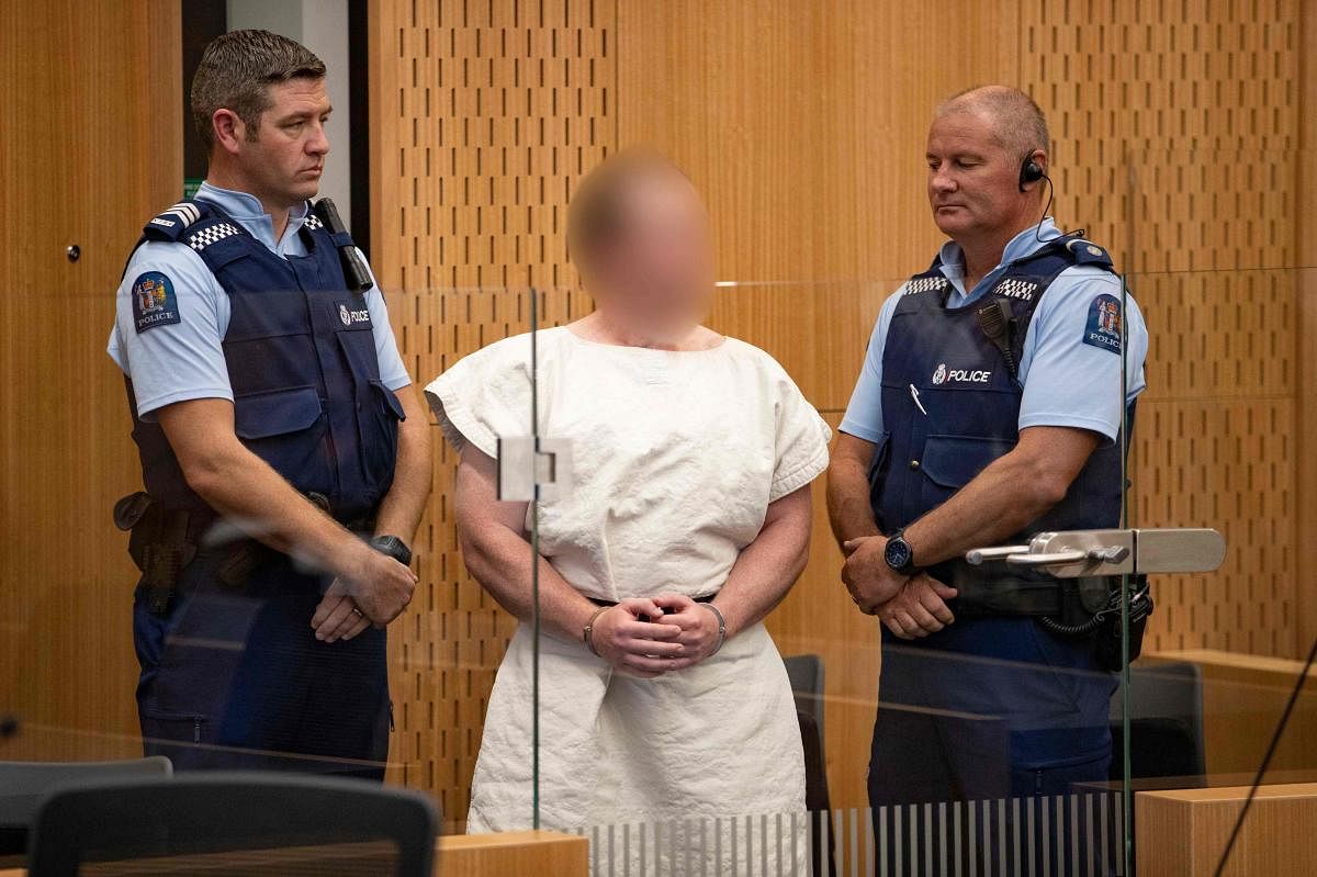 Brenton Tarrant, the man charged in relation to the Christchurch massacre appear in the dock charged with murder in the Christchurch District Court on March 16, 2019. - A right-wing extremist who filmed himself rampaging through two mosques in the quiet N