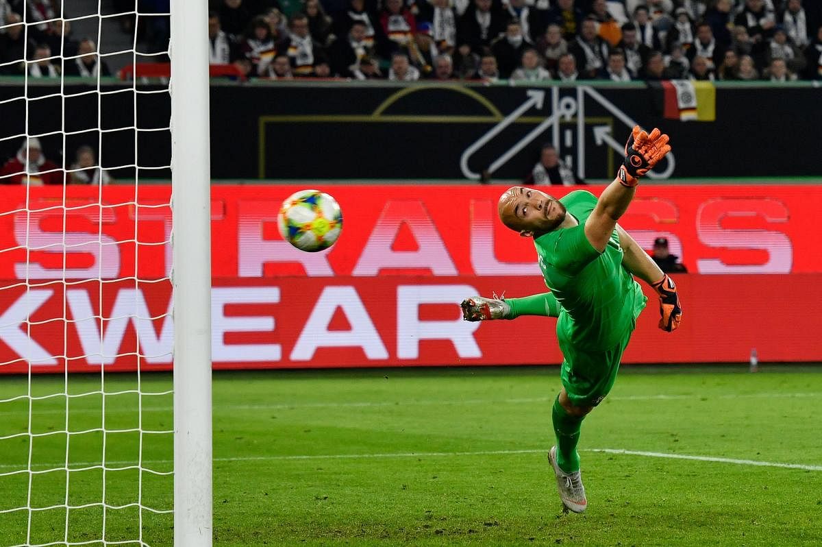 Serbia's goalkeeper Marko Dmitrovic watches in vain as Germany's Leon Goretzka's shot soars into the goal during their friendly on Wednesday. AFP