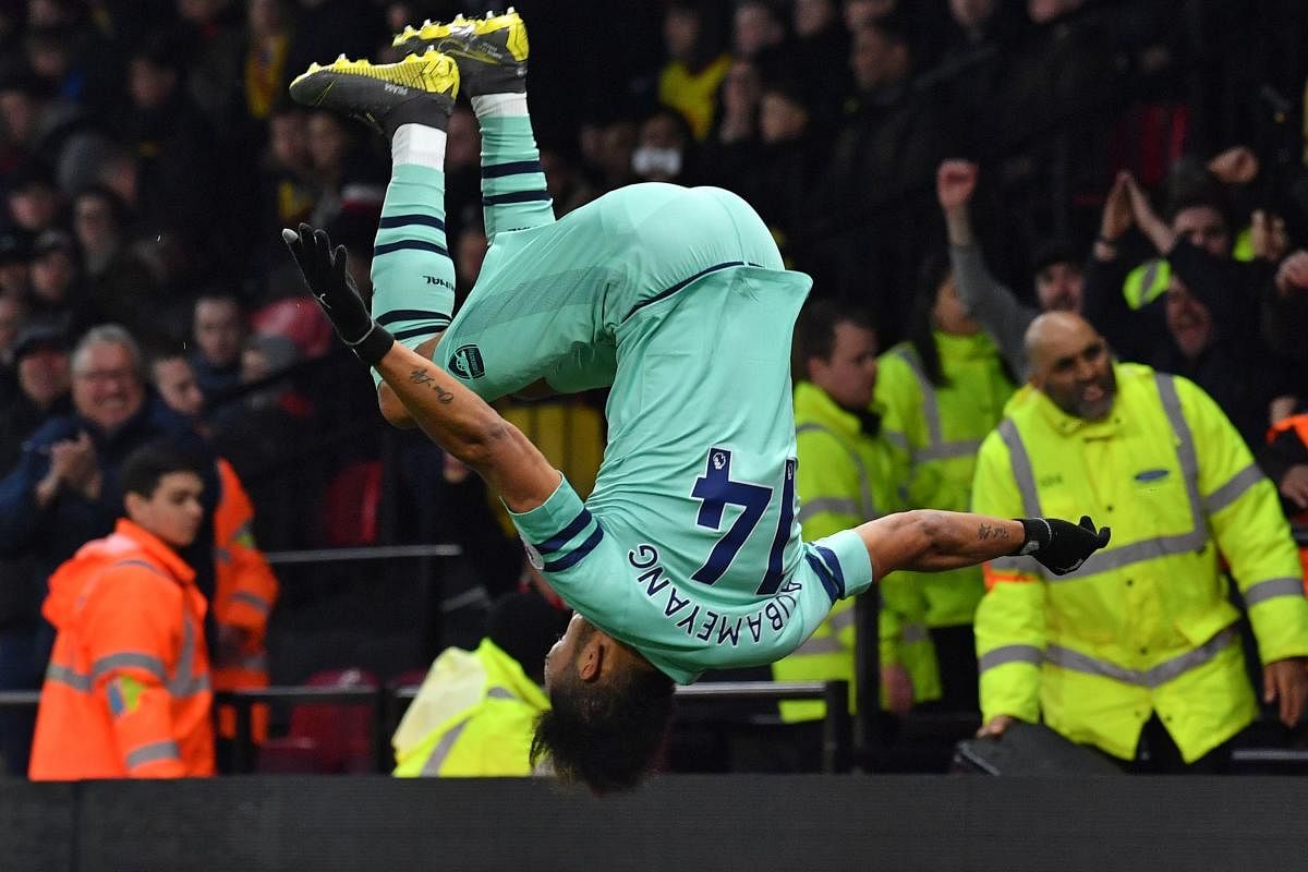 Arsenal's Pierre-Emerick Aubameyang celebrates in acrobatic fashion after scoring against Watford on Monday. AFP