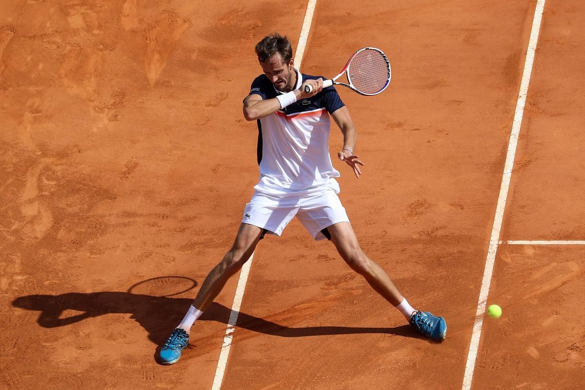 IN CONTROL: Russia’s Daniil Medvedev hits a return to Serbia’s Novak Djokovic during their quarterfinal at the Monte Carlo Masters on Friday. AFP