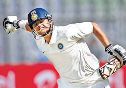 making a statement: Rest of Indias Suresh Raina is jubilant after scoring a century against Mumbai on day two of their Irani Cup match on Thursday. PTI