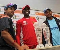 Zimbabwean Cricket captain, Elton Chigumbura, centre, Sri Lankan Cricket captain,Tillakaratne Dilshan, right and Indian Cricket Captain ,Suresh Raina, left, at the unveiling of the Micromax series trophy at a local hotel in Bulawayo, about 500 kilometers south of Harare on Thursday. AP