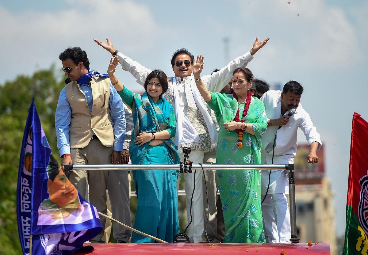 Samajwadi Party candidate from Lucknow Poonam Sinha with party MP Dimple Yadav and Congress candidate from Patna Sahib husband Shatrughan Sinha during a roadshow enroute filing her nomination papers, in Lucknow, Thursday, April 18, 2019. (PTI Photo)