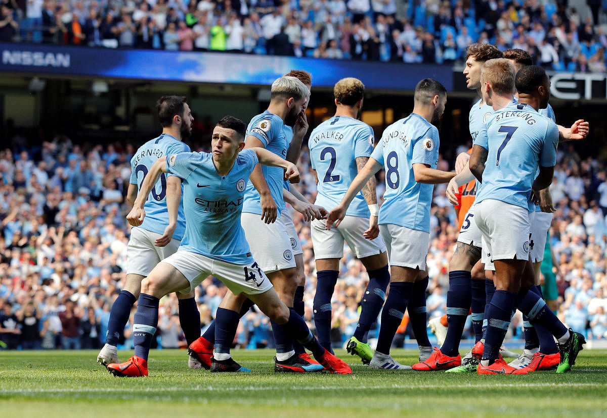 STATEMENT WIN: Manchester City's Phil Foden (left) celebrates scoring the winner against Tottenham on Saturday. Reuters