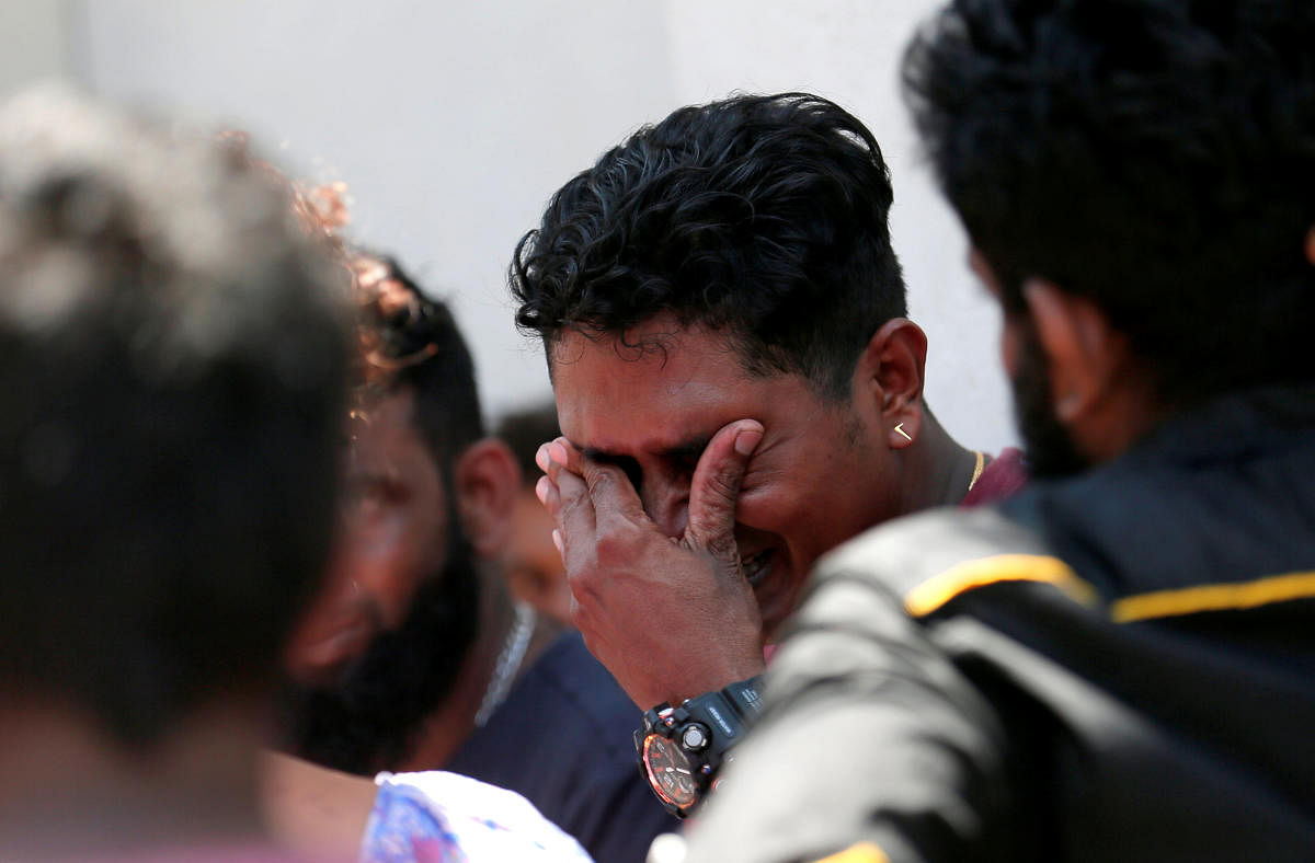 A relative of a victim of the explosion at St. Anthony's Shrine, Kochchikade church reacts at the police mortuary in Colombo. Reuters photo