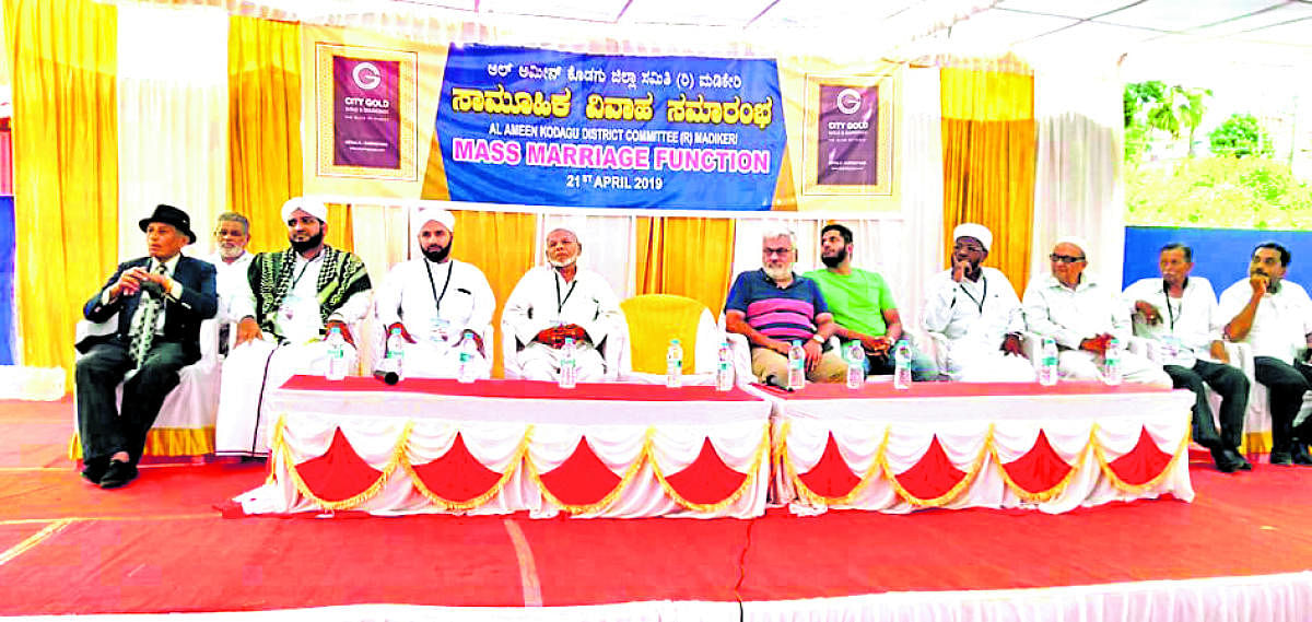 Dignitaries take part in a mass marriage programme in Madikeri.