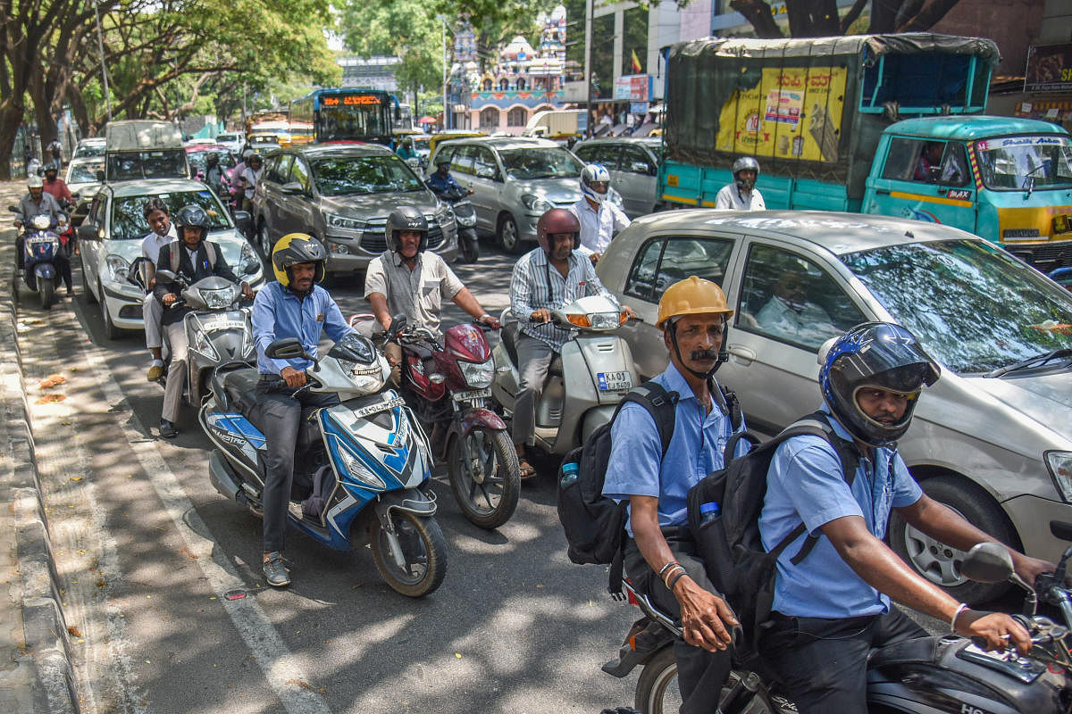 Traffic is jammed at Rajaram Mohan Roy road in Bengaluru on Friday, due to various party leaders came in rally to submitting nomination for Lok Sabha election in BBMP Head Office. Photo by S K Dinesh