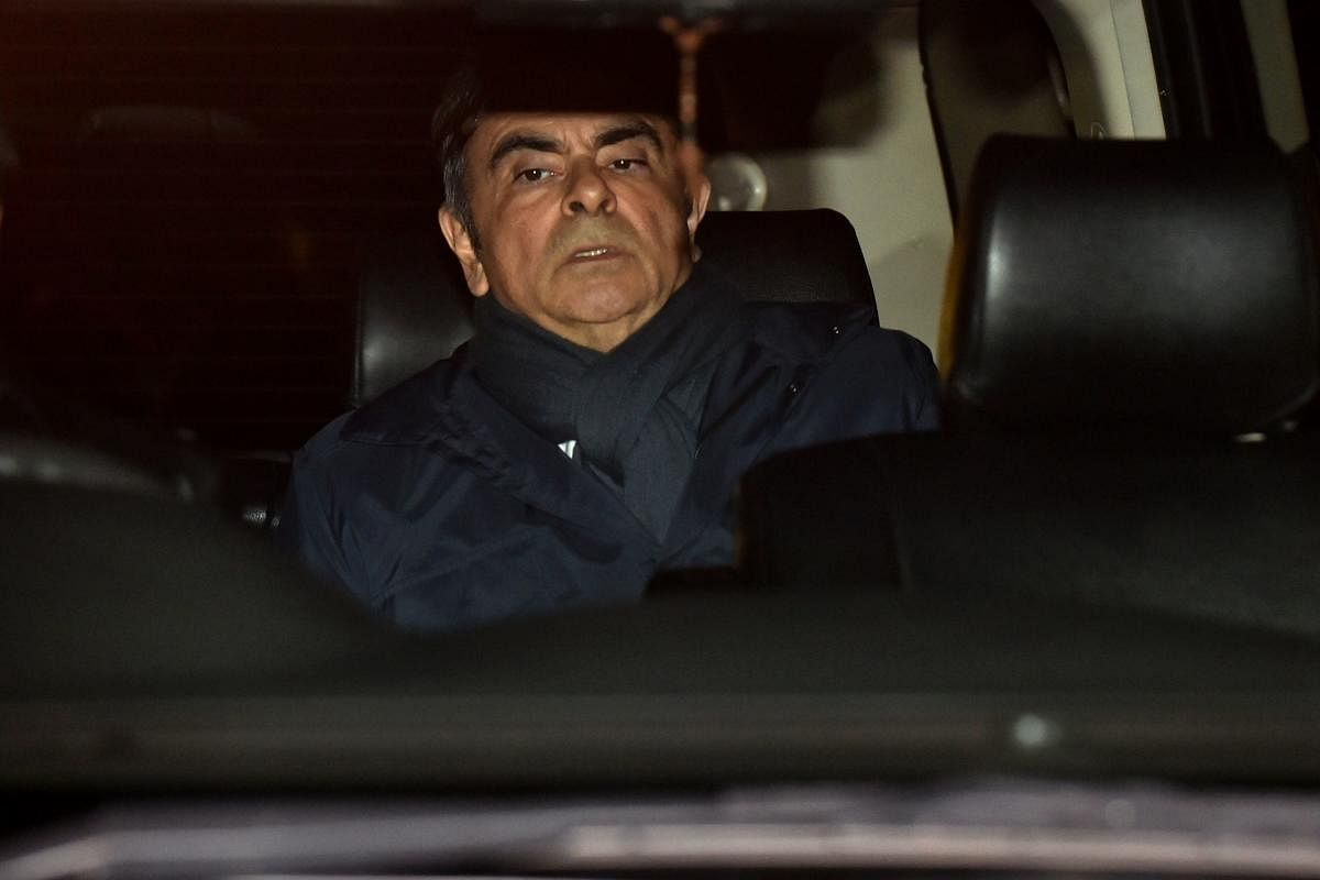 This file photo shows former Nissan chairman Carlos Ghosn leaving his lawyer's office in Tokyo. (AFP)