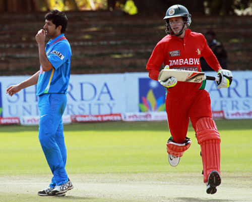 Zimbabwean batsman Malcom Waller, right, makes a run as Indian bowler Mohit Sharma looks on, during the fourth, one day international match against Inida, at Queens Sports Club, in Bulawayo, Zimbabwe, Thursday, Aug. 1, 2013. AP Photo