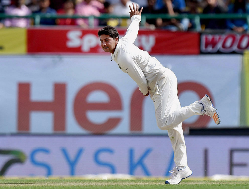 India's Kuldeep Yadav in action against Australia during the first day of last test match at HPCA Stadium in Dharamsala on Saturday. PTI Photo