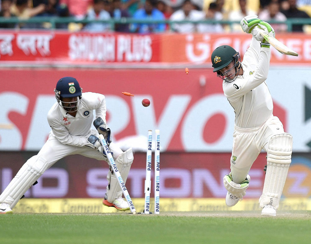 Cleaned up: Australia's Peter Handscomb has his stumps disturbed by a brilliant ball from India's Kuldeep Yadav. PTI