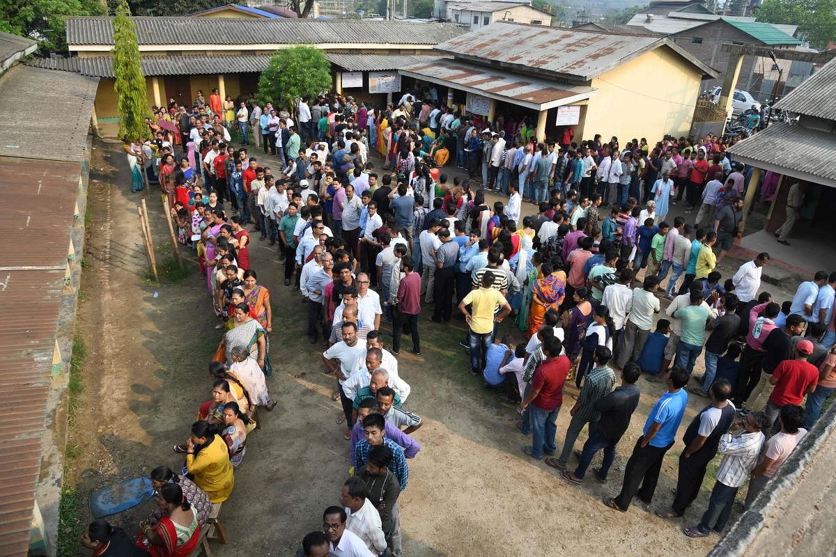 Indian voters stand in lines at a polling station during the third phase of India's general election in Guwahati, the capital city of India’s northeastern state of Assam, on April 23, 2019. ( AFP)