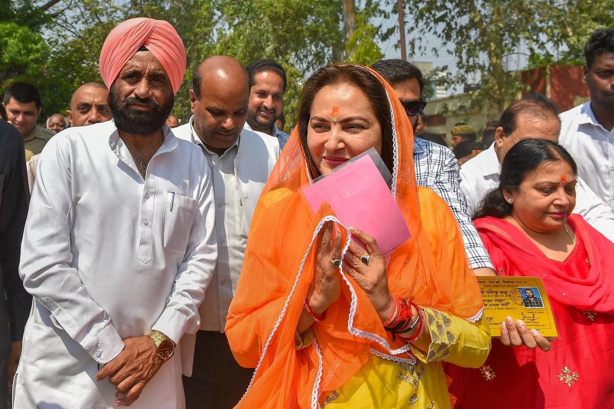 BJP parliamentary candidate from Rampur, Jaya Prada, arrives to cast her vote during the third phase of the 2019 Lok Sabha elections, at a polling station in Rampur, Tuesday, April 23, 2019. (PTI Photo)