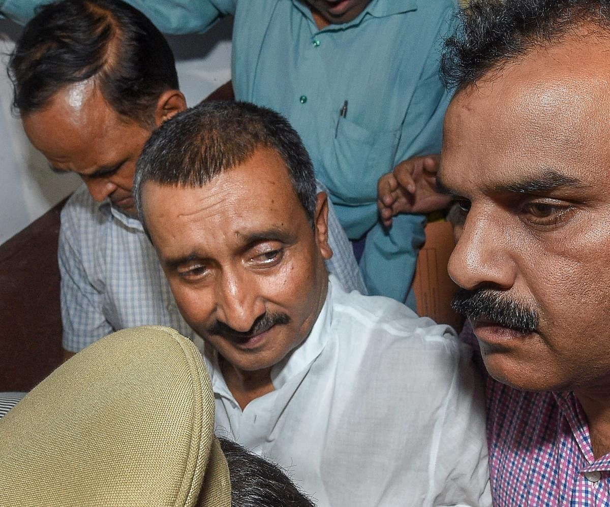 Rape accused MLA Kuldeep Singh Sengar being taken away from the CBI court in Lucknow. PTI File Photo