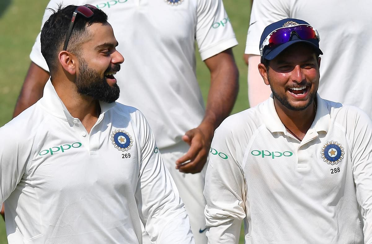FAST LEARNER: Chinaman bowler Kuldeep Yadav (right) could be a potent weapon for skipper Virat Kohli when India travel to Australia at the end of the year. AFP