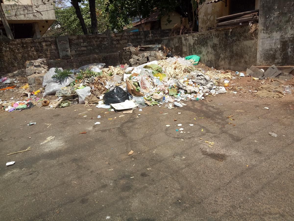 Garbage left unattended to in one of the localities in Mangaluru on Tuesday.