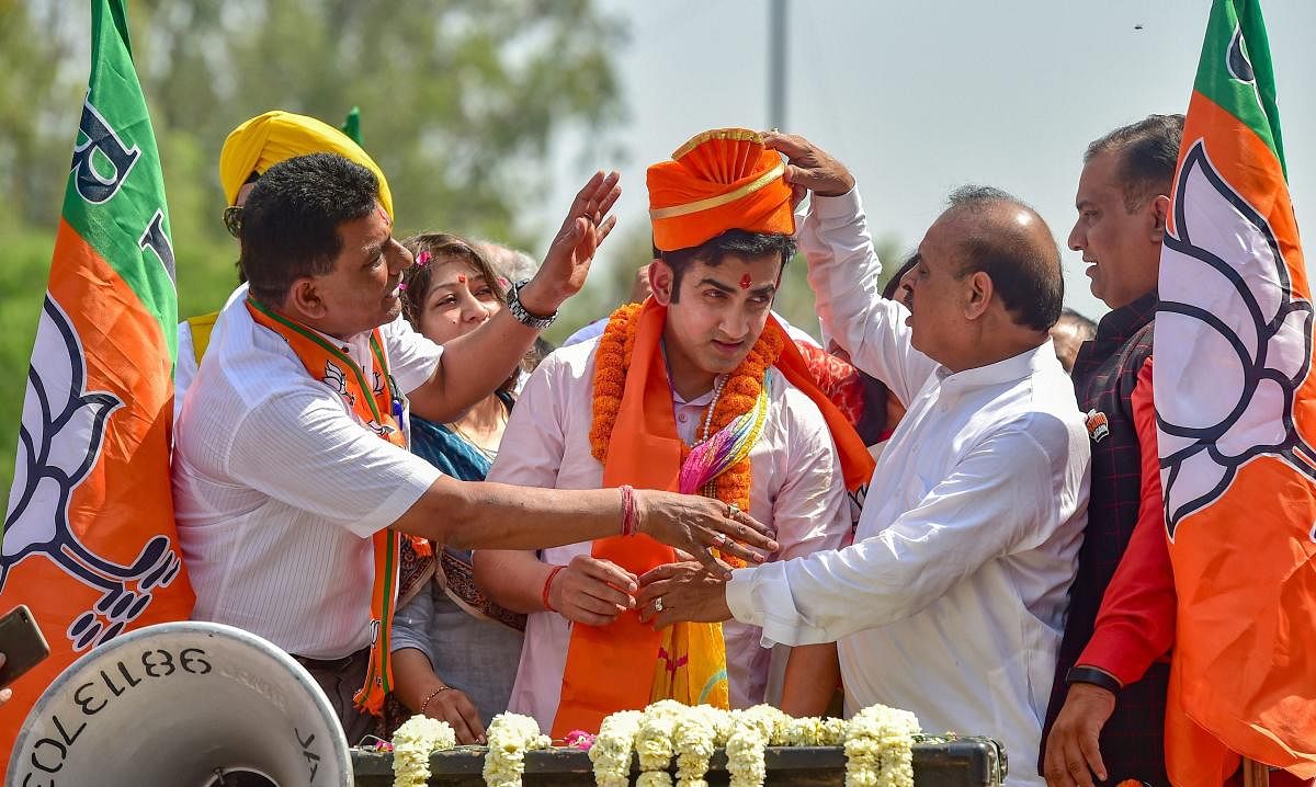 Former cricketer and BJP candidate from East Delhi Gautam Gambhir during a roadshow to file his nomination papers for the Lok Sabha elections, in East Delhi on Tuesday. (PTI Photo)
