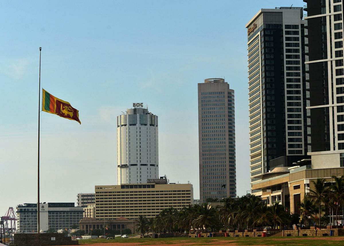 Sri Lanka's national flag flies at half mast at the Galle Face Green promenade in Colombo on April 23, 2019, two days after a series of bomb attacks targeting churches and luxury hotels in Sri Lanka. (AFP)