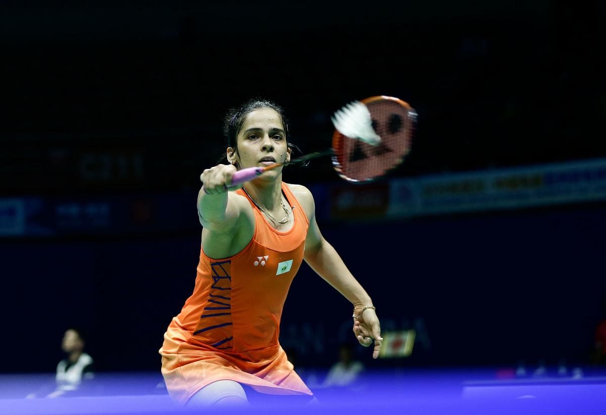 GUTSY: India's Saina Nehwal returns during her hard-fought win over Han Yue of China in the first round of the Asia Badminton Championship in Wuhan on Wednesday. AFP 