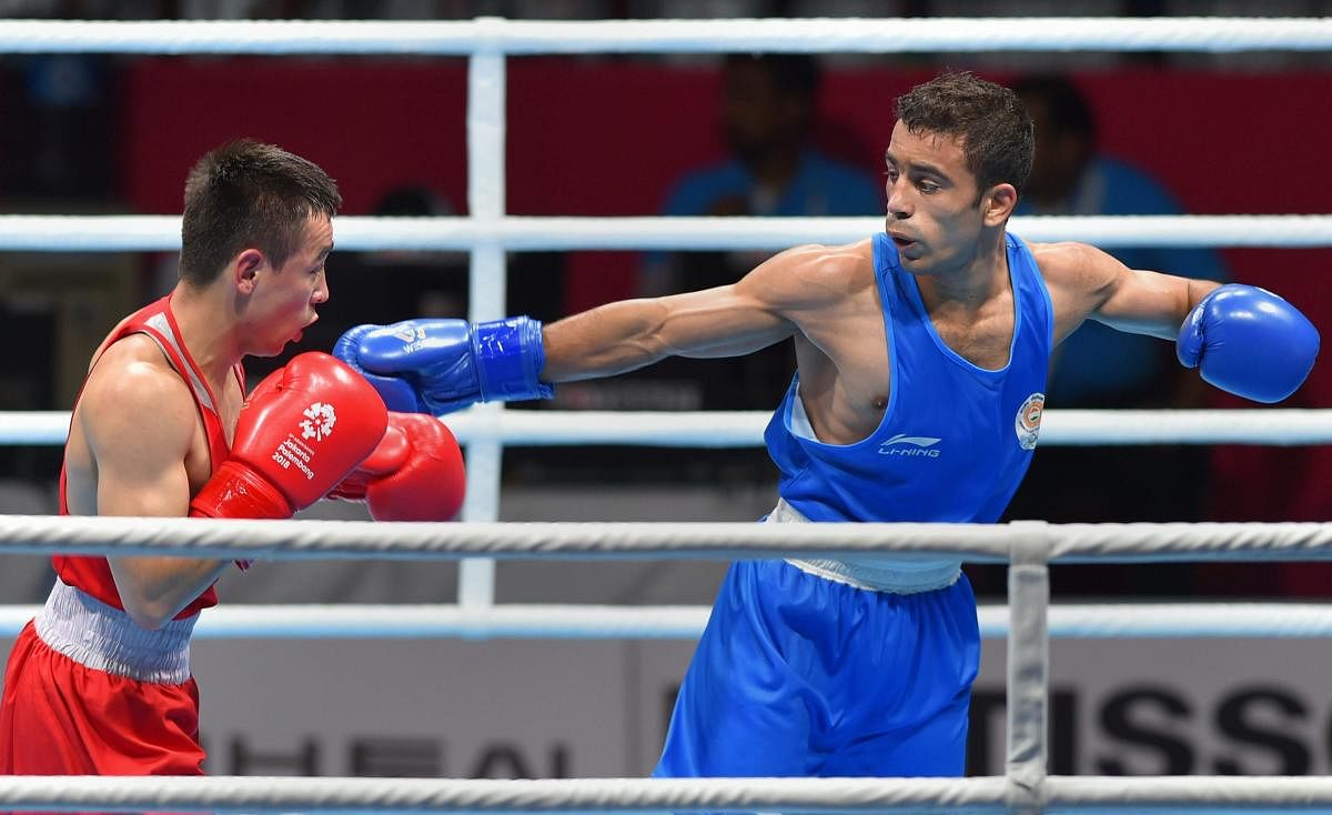 Amit Panghal (right) marched into the final (52kg) of the Asian Boxing Championships with a split verdict win over China's Hu Jianguan on Thursday. PTI FILE PHOTO