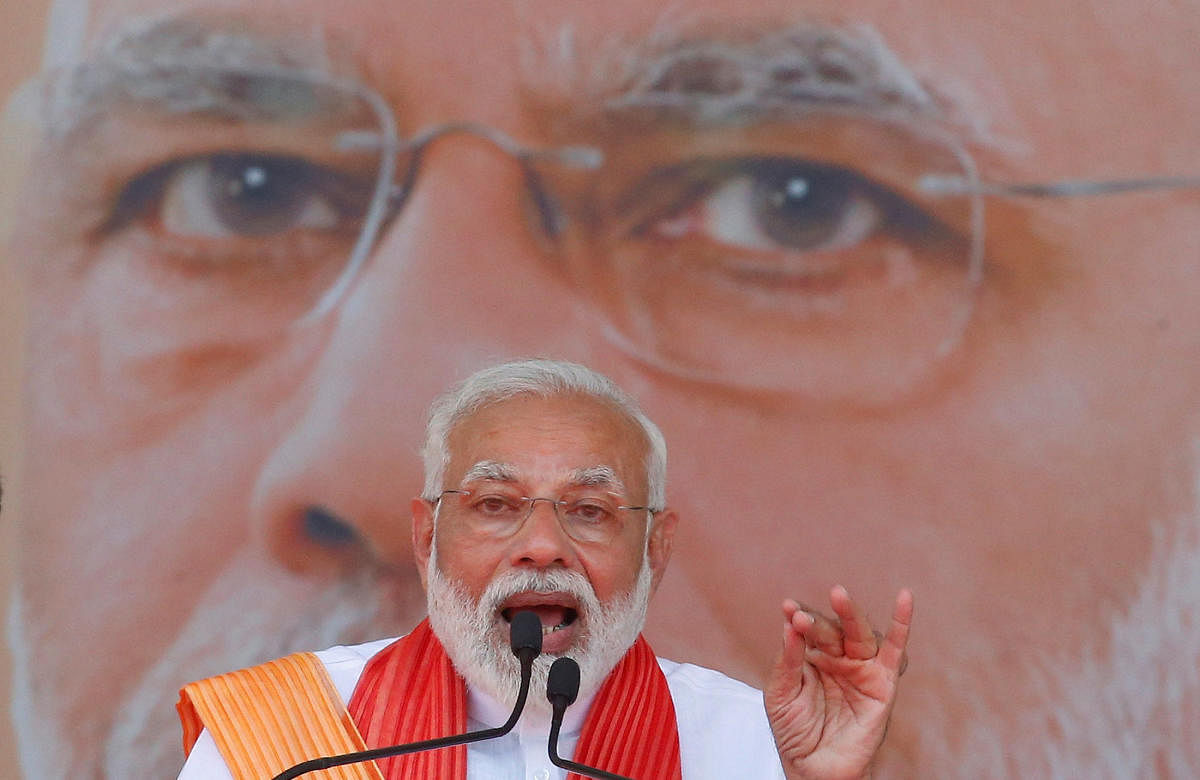 Prime Minister Narendra Modi addresses his supporters during an election campaign rally in Patan, Gujarat. PTI