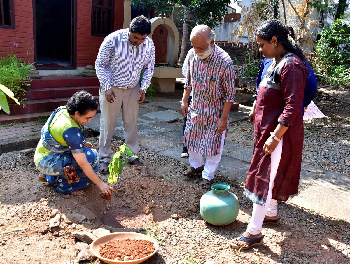 Nitte University Center of Science and Research Professor Dr Smitha Hegde plants a sapling on the premises of Guttu House in Kodialbail, Mangaluru, on the occasion of ‘Ila 2019’, organised on the lines of World Earth Day, by Nitte Institute of Communication.