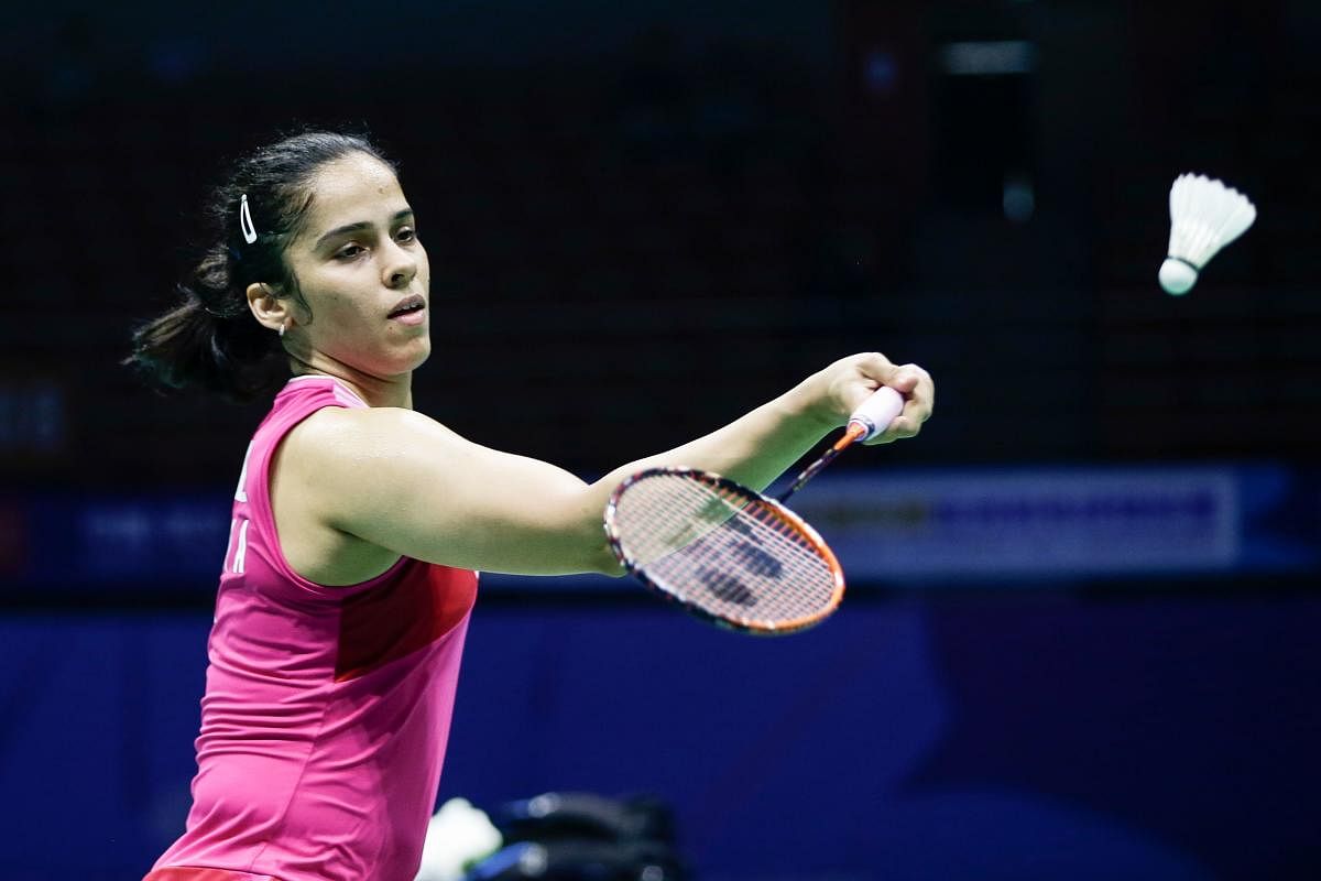 EASILY DONE: Saina Nehwal of India returns during her win over Kim Ga-eun of South Korea. AFP