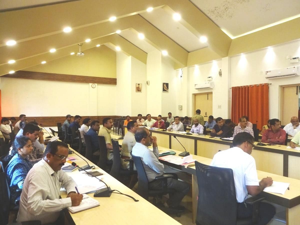 Officials of various departments take part in the meeting on drinking water and drought management, at the deputy commissioner's office, on Thursday.