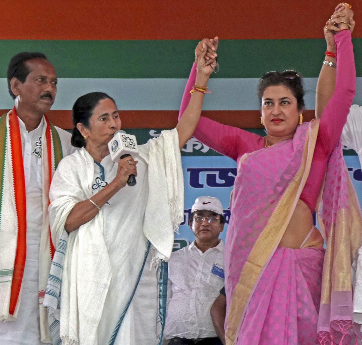 TMC supremo Mamata Banerjee campaigns for party candidates Satabdi Roy (R) from Birbhum constituency and Asit Mal (L) from Bolpur constituency in a rally at Suri in Birbhum district of West Bengal on Thursday. PTI