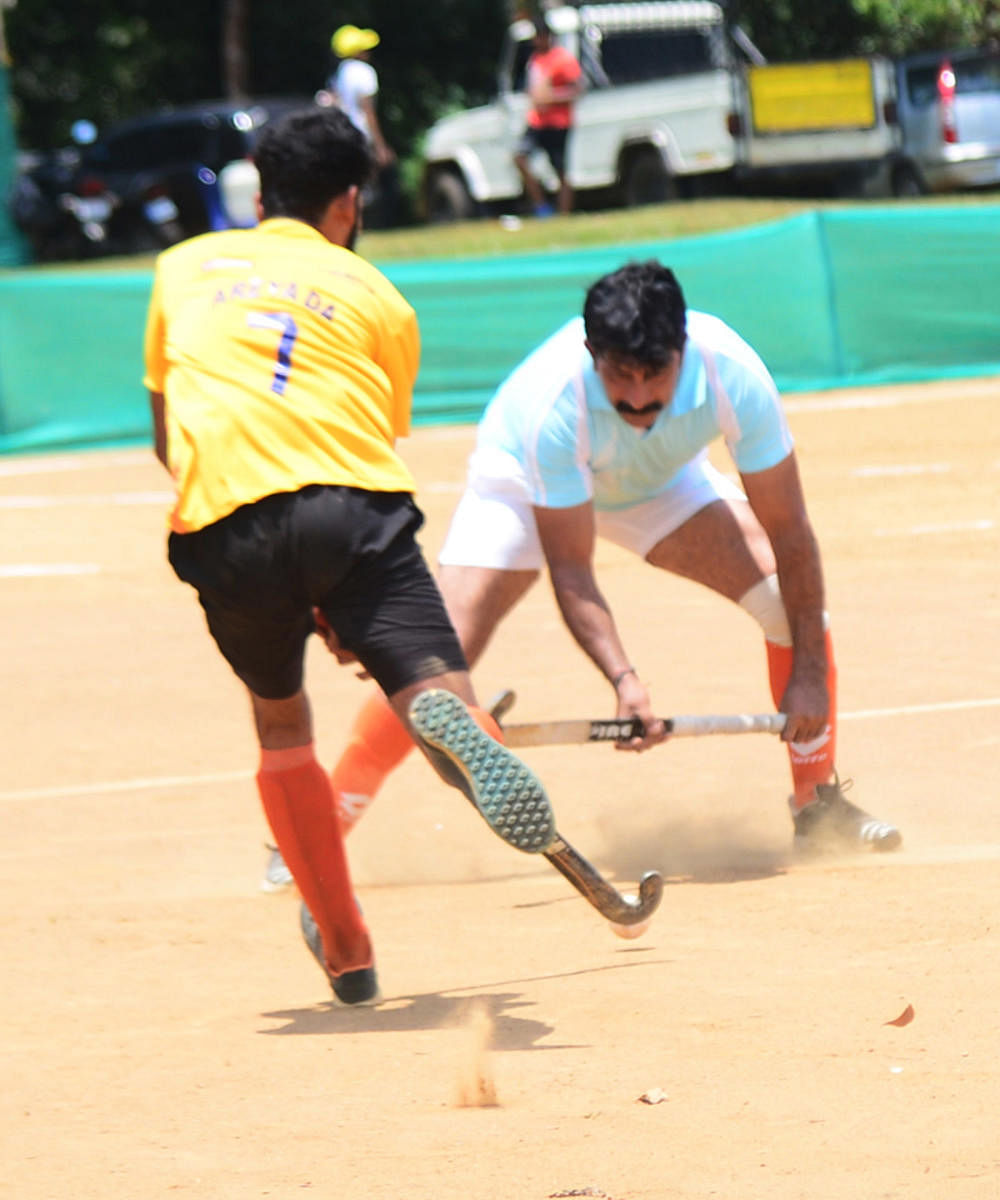 Anjaparavanda and Areyada in action during a match at General K S Thimayya ground in Napoklu on Thursday.