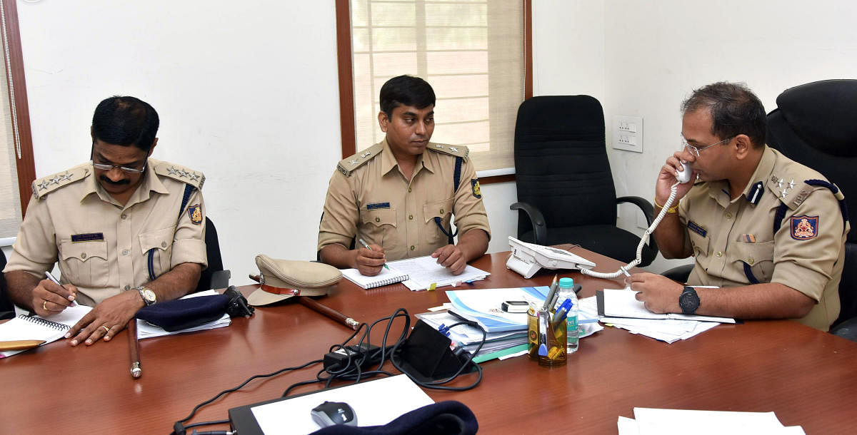 Mangaluru City Police Commissioner Sandeep Patil receives a complaint during the weekly phone-in programme held on Friday.