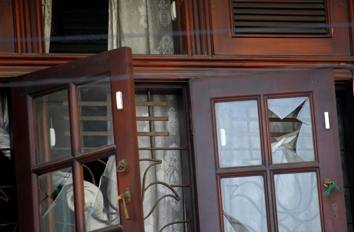 Broken windows are seen at the family home of a bomber suspect where an explosion occurred during a Special Task Force raid, following a string of suicide attacks on churches and luxury hotels, in Colombo, Sri Lanka April 25, 2019. REUTERS