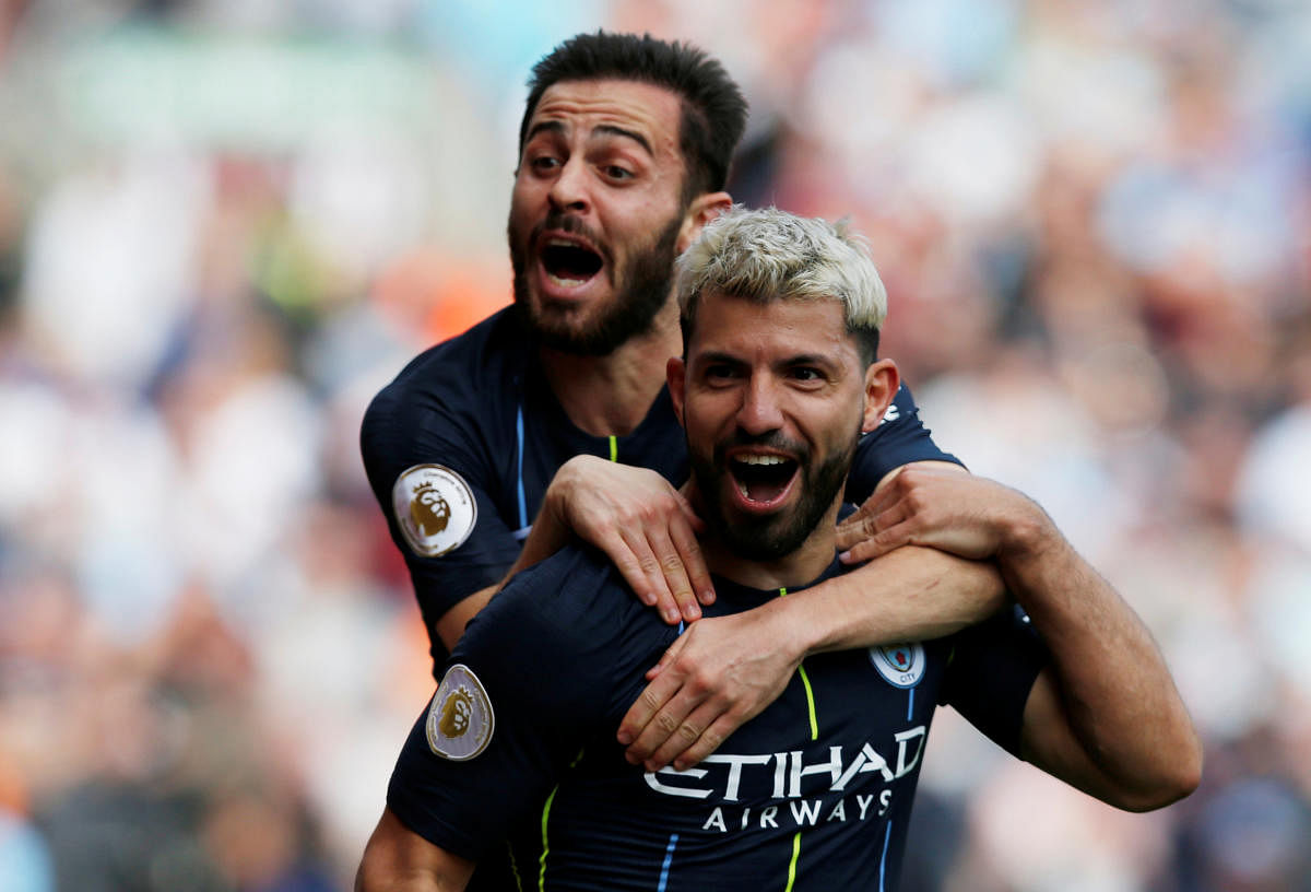 ON A ROLL: Manchester City's Sergio Aguero celebrates with team-mate Bernardo Silva after scoring their first goal against Burnley. Reuters