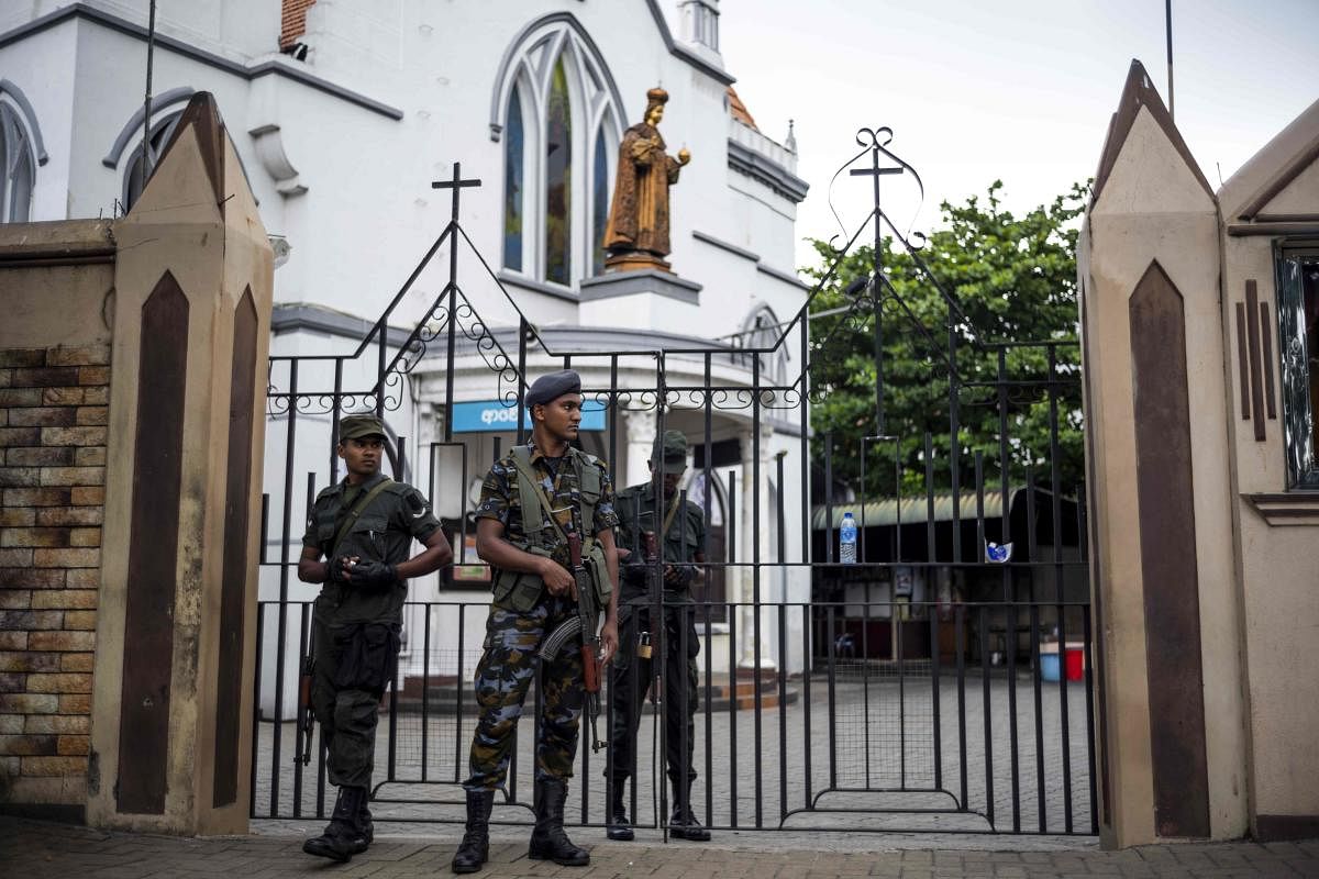 Sri Lankan soldiers stand guard outside a closed church in Colombo. AFP photo