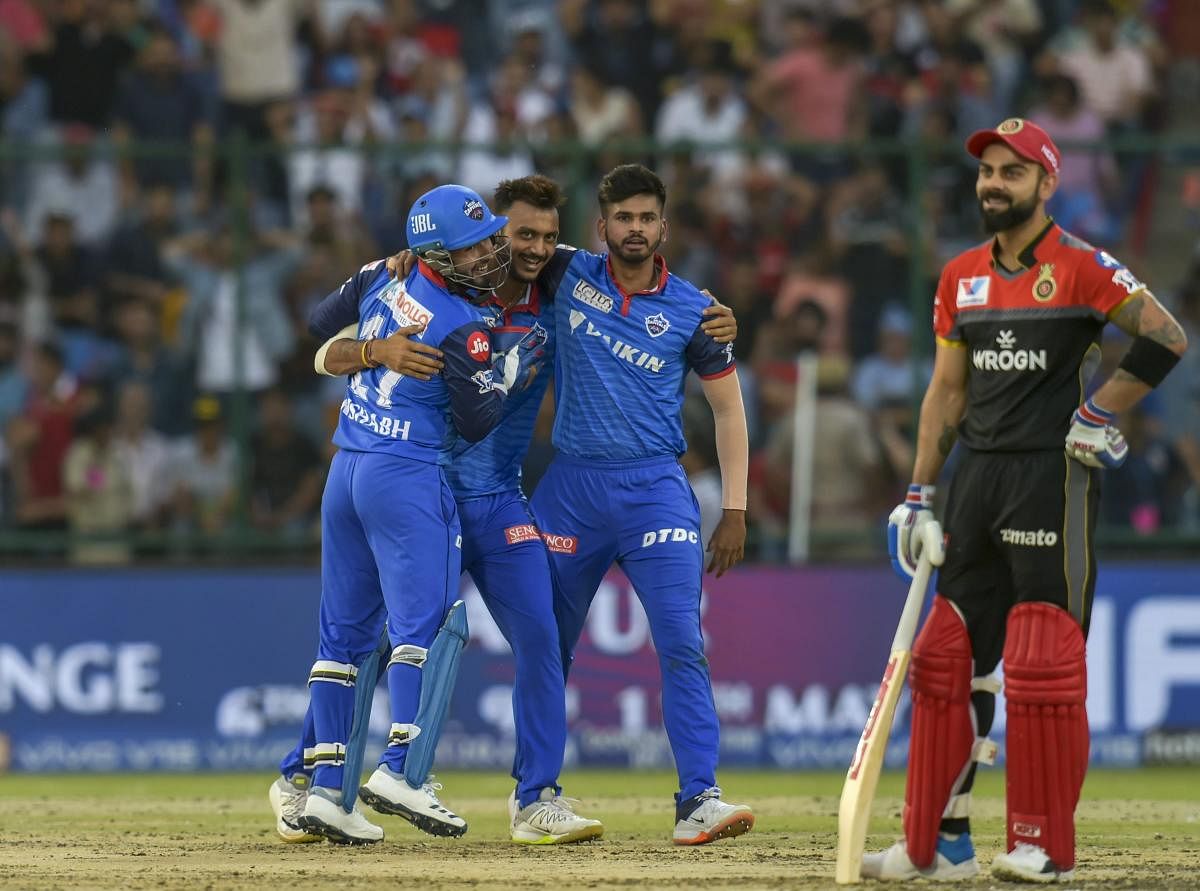 GOT TO BE KIDDING: RCB skipper Virat Kohli sports a wry smile as Delhi Capitals players celebrate his dismissal in New Delhi on Sunday. PTI