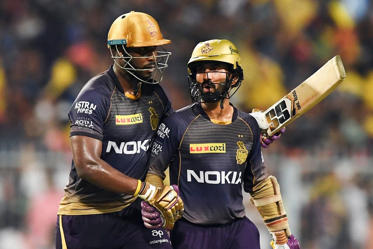 Andre Russell (left) with Dinesh Karthik.