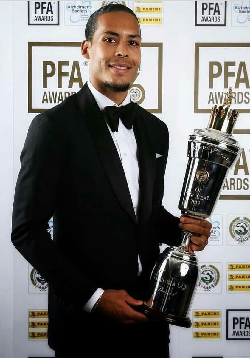 Liverpool's Virgil van Dijk with the PFA Player of the Year trophy on Sunday. 