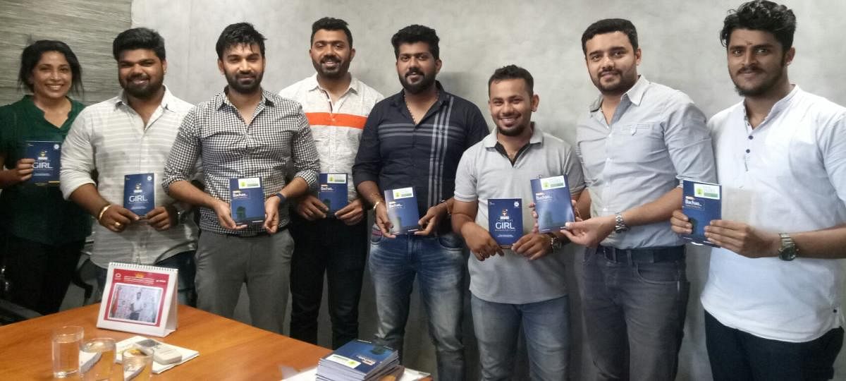 Young entrepreneur Darshan Jain (fourth from left) with like-minded friends during the release of ‘Cyber Safe Girl-Beti Ko Bachao, Cyber Crime Se’ at ACE office in Empire Mall in Mangaluru on Monday.