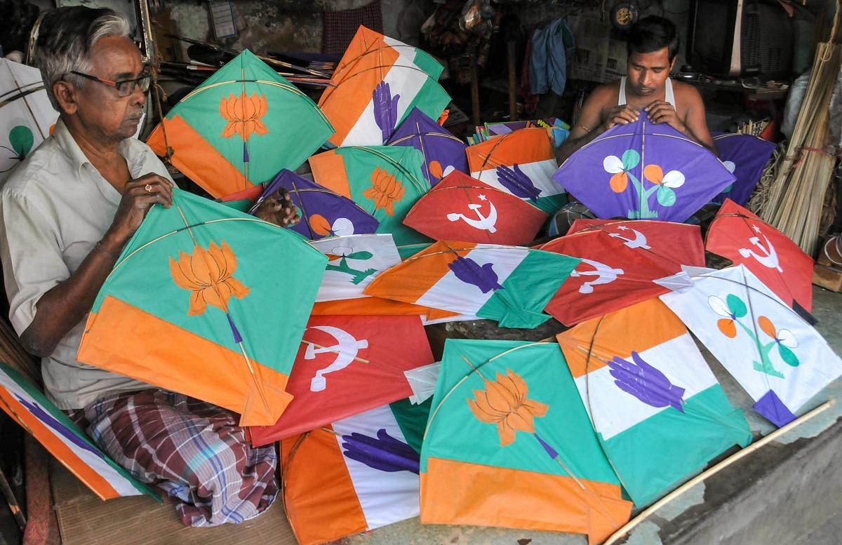 Kite makers prepare kites with different political party's symbols ahead of Lok Sabha elections, in Kolkata, Monday, March 18, 2019. (PTI Photo)