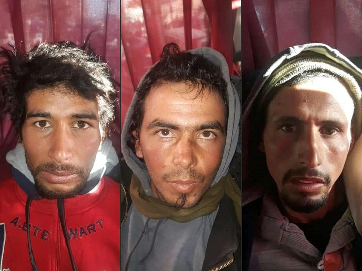 This combination of pictures created on December 20, 2018 shows Rachid Afatti (L), Ouziad Younes (C), and Ejjoud Abdessamad (R), the three suspects in the grisly murder of two Scandinavian hikers whose bodies were found at a camp in Morocco's High Atlas mountains, in police custody following their arrest. AFP PHOTO / HO / MOROCCAN POLICE