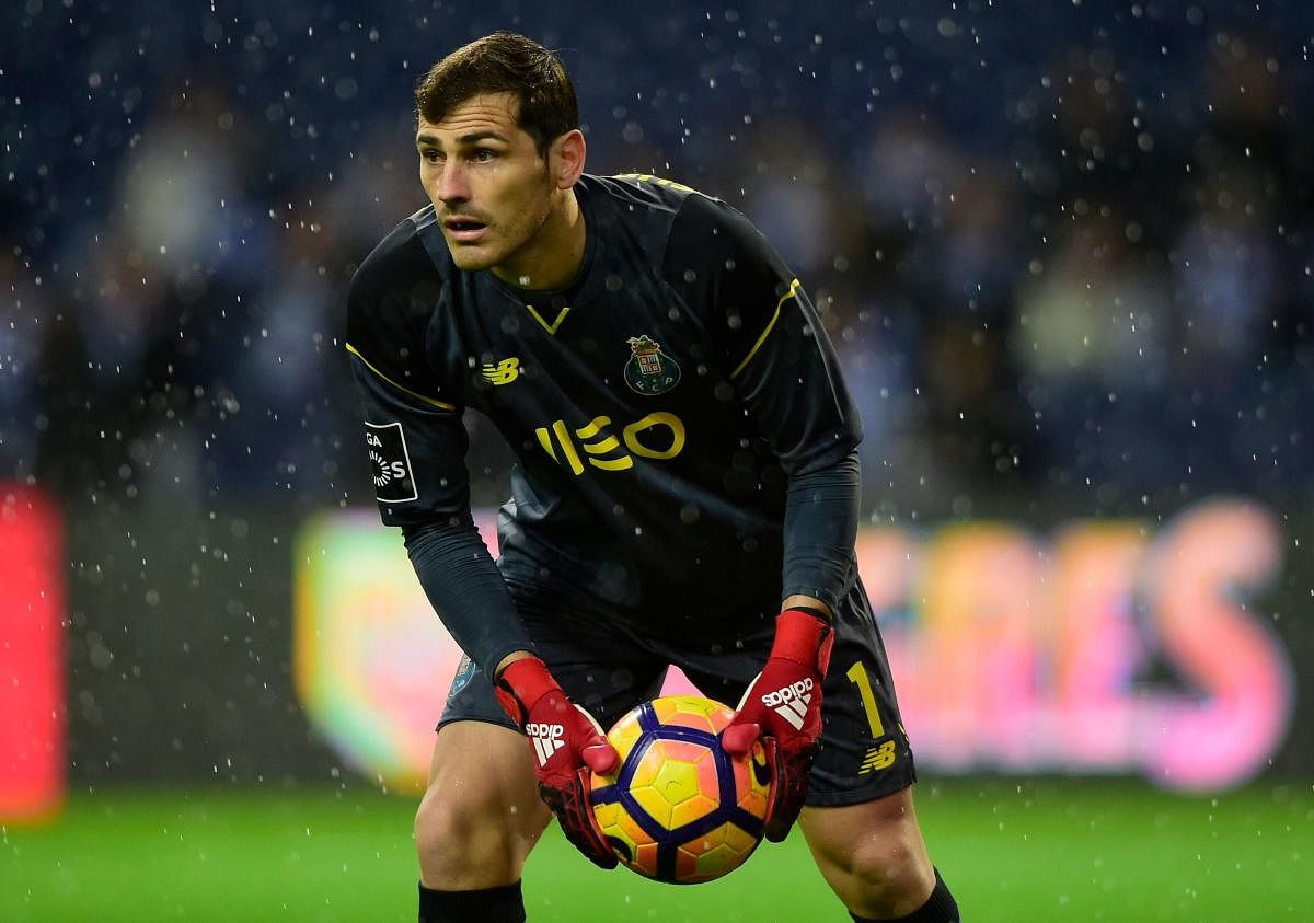 In this file photo taken on December 15, 2016 Porto's Spanish goalkeeper Iker Casillas catches a ball during the Portuguese league football match FC Porto vs CS Maritimo at the Dragao stadium in Porto. - Casillas is stable in hospital after suffering a he