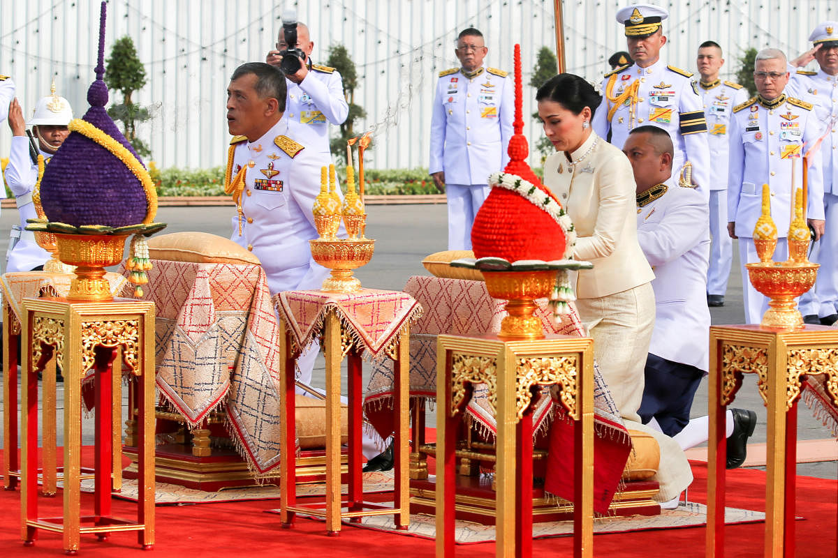 Thailand's King Maha Vajiralongkorn and Queen Suthida pay their respect at the statue of King Rama V at the Royal Plaza in Bangkok, Thailand. Reuters photo