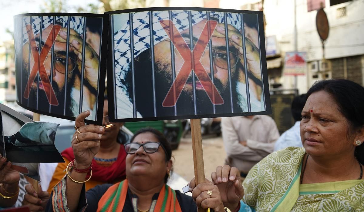 BJP supporters prepare to burn photos of Pakistan based terrorist Masood Azhar, in Ahmedabad on May 2, 2019, following the United Nations Sanctions Committee to include Jaish-e-Muhammad (JeM) chief Masood Azhar in its list of global terrorists. (AFP File Photo)