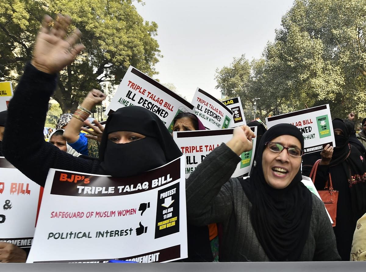 India Movement activists during a protest against the Triple Talaq Bill at Parliament Street, in New Delhi. PTI Photo 