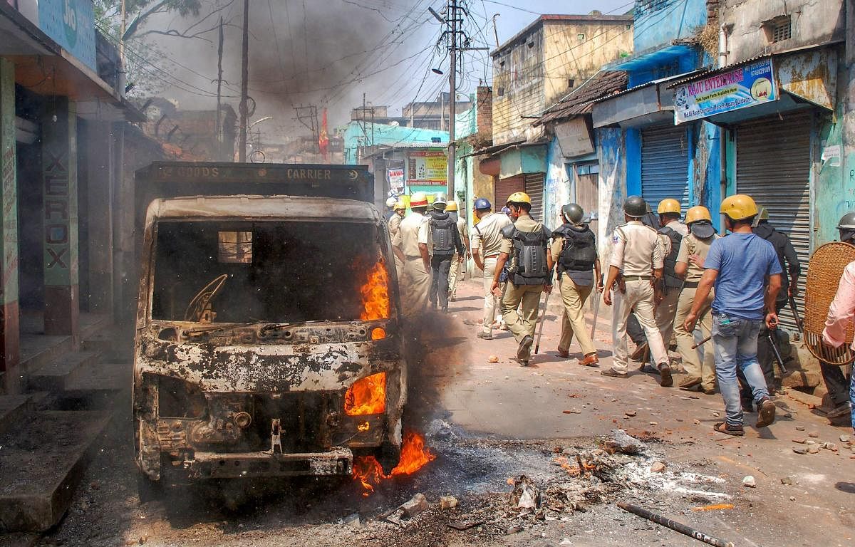 Police personnel patrol after clashes and incidents of arson over Ram Navami procession at Raniganj in Burdwan district in March 2018. PTI