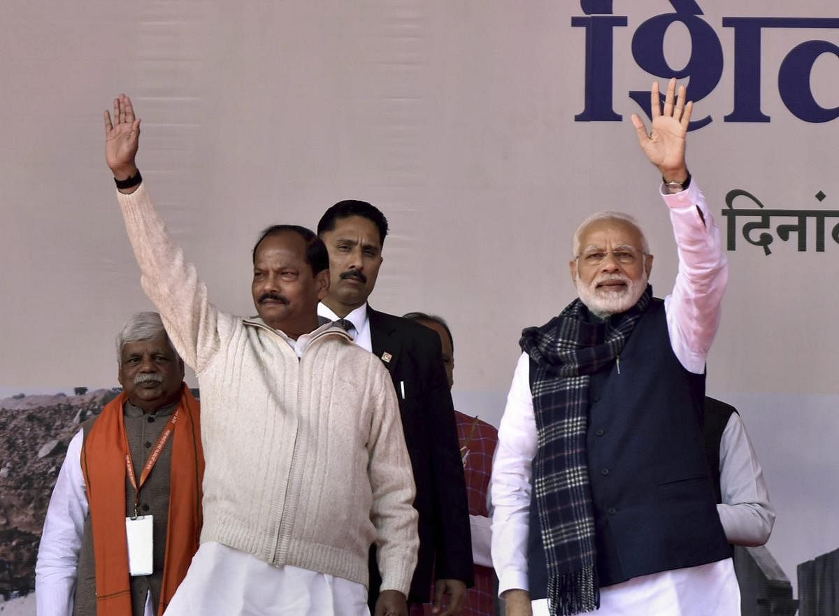 Prime Minister Narendra Modi and Jharkhand Chief Minister Raghubar Das wave to the gathering during the foundation stone laying ceremony of six irrigation projects at Medininagar, in Palamu district. PTI Photo 