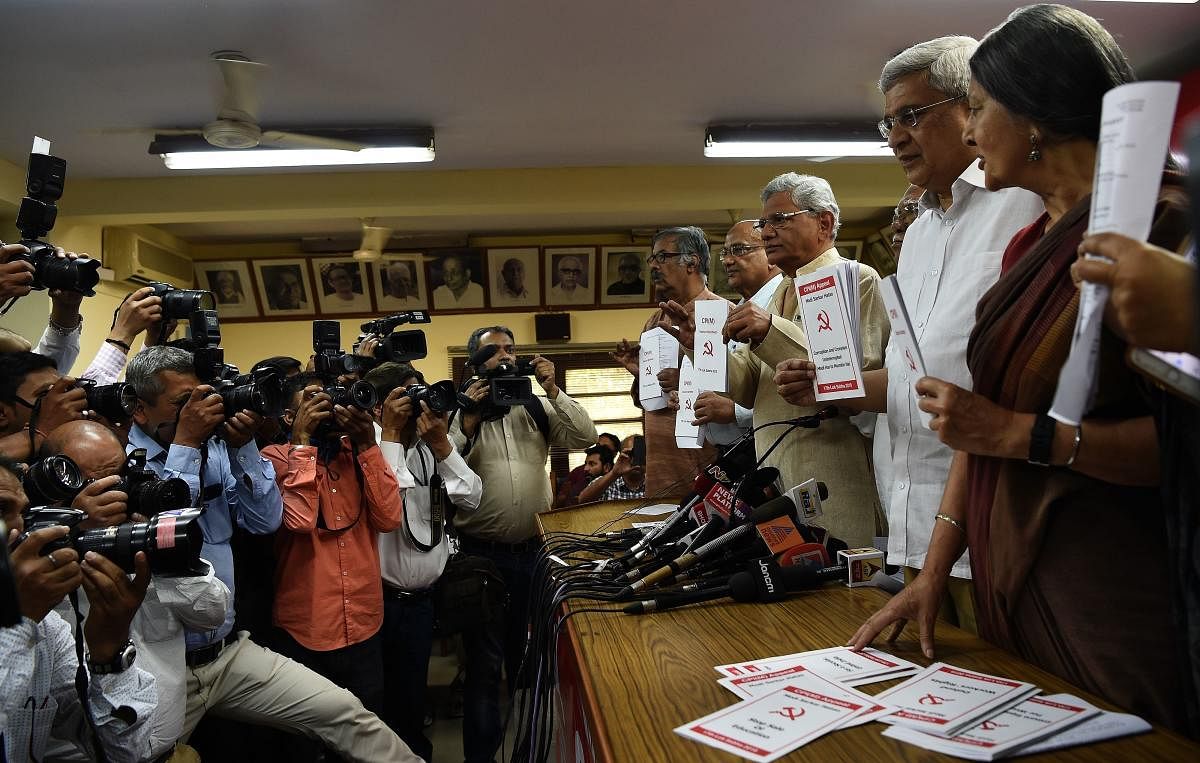 Communist Party of India (M) general secretary Sitaram Yechury (3R), along with other leaders, poses with the party's manifesto for the "General Election 2019" at the CPM headquarters in New Delhi on March 28, 2019. AFP