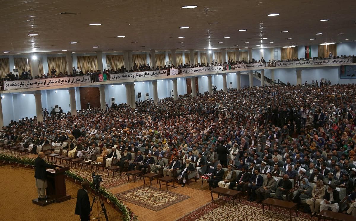 Afghan people attend the first day of the "loya jirga" (grand assembly) in Kabul. - Afghanistan's usually bustling capital Kabul slowed to a crawl on April 30 amid massive security for a high-stakes peace summit that has previously been a target for insur