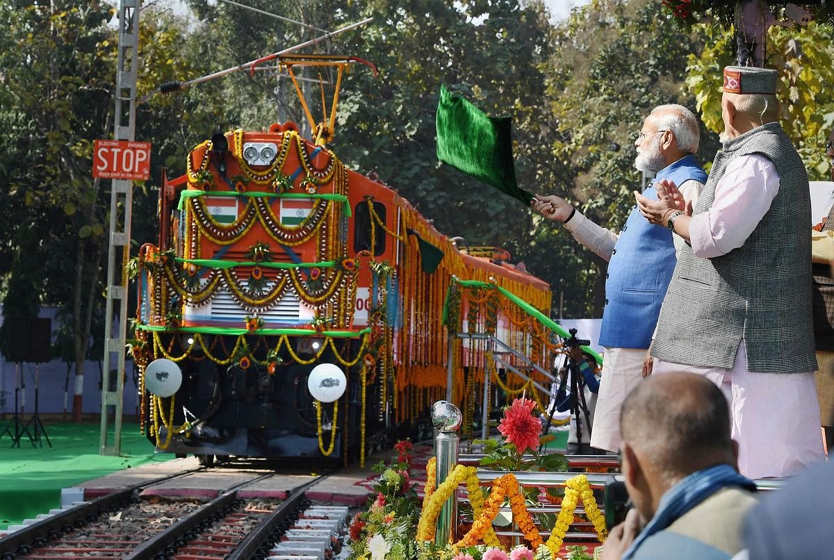Prime Minister Narendra Modi flags off an elctric locomotive converted from a diesel engine at Diesel Locomotive Works (DLW), in Varanasi on Feb. 19, 2019. (PIB/PTI Photo)